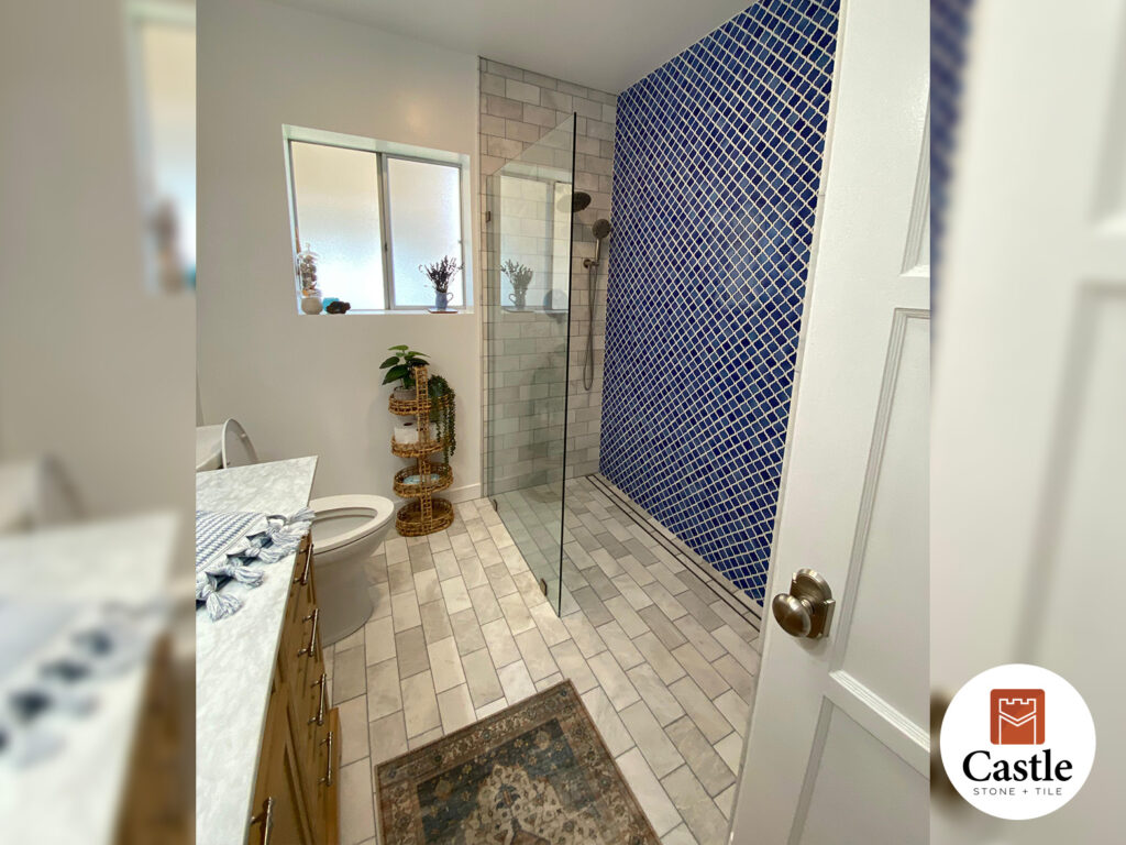 Our San Diego project included repairing a damaged subfloor and leveling the bathroom floor by 1 ½ inches. The remodel features a curbless shower with a 5 ft linear drain, bold blue Arabesque tile, and classic 3x6 stone.