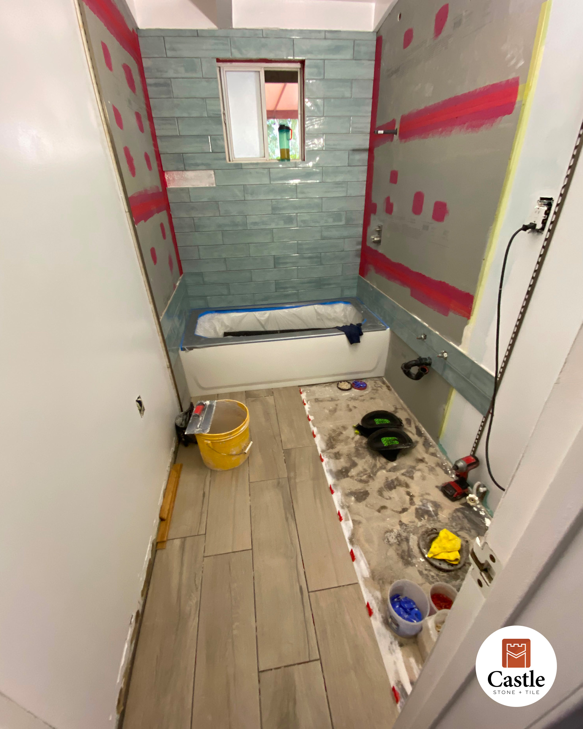 4x12 wall tile with wood look plank tile on floor Poway