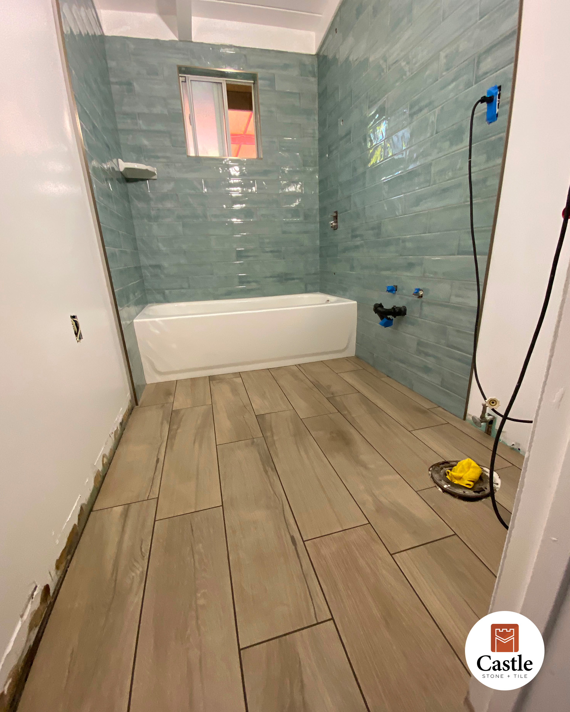 4x12 wall tile with wood look plank tile on floor Poway 3